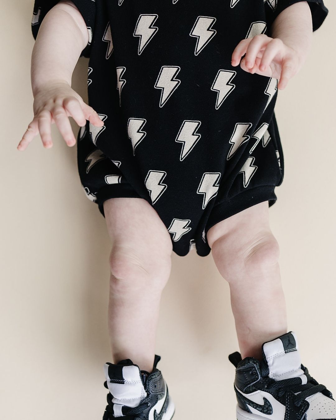 Short Sleeve Bubble Romper | Black Bolts